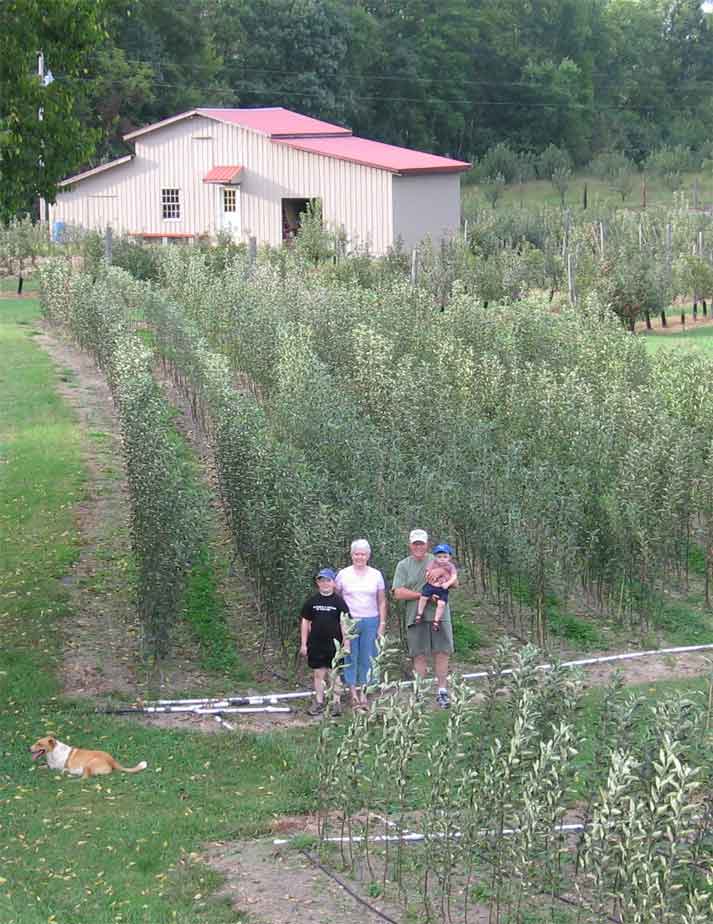 family standing in trees